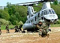 Some Marines load a simulated casualty into a Sea Knight