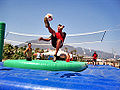 Bossaball : Player about to kick the ball into the game.