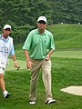 Davis Love III, preparing to sign autographs as he walks off the 17th green of the Congressional Country Club's Blue Course during the Earl Woods Memorial Pro-Am prior to the 2007 AT&T National tournament.