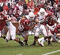 Travis Lewis of the Oklahoma Sooners tackles an offensive player for the Idaho State Bengals during a 2009 game