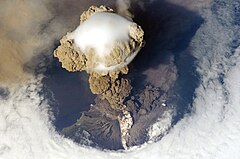 #3: Sarychev Peak Volcano erupts June 12, 2009, on Matua Island (North Kuril Islands) (POTD) – Credit: Original photo by NASA, uploaded on Flickr by user John, derivative work by The High Fin Sperm Whale. (CC-BY-SA‑2.0)