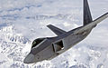 An F-22 Raptor veers to the right over Alaska's mountainous terrain April 15 after an in-flight refueling mission. The Raptor was one of several refueled by a KC-135 Stratotanker before returning to Elmendorf Air Force Base, Alaska.