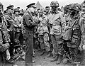 Gen. Dwight D. Eisenhower gives the order of the Day. `Full victory-nothing else' to paratroopers in England, just before they board their airplanes to participate in the first assault in the invasion of the continent of Europe