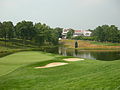 The 18th green of the Congressional Country Club's Blue Course during the 2007 AT&T National tournament, with the clubhouse in the background.