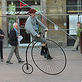 Man riding an ordinary bicycle