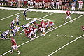 Landry Jones, quarterback for the Oklahoma Sooners, leads the offense during his first series as a collegiate athlete following an injury to starter Sam Bradford