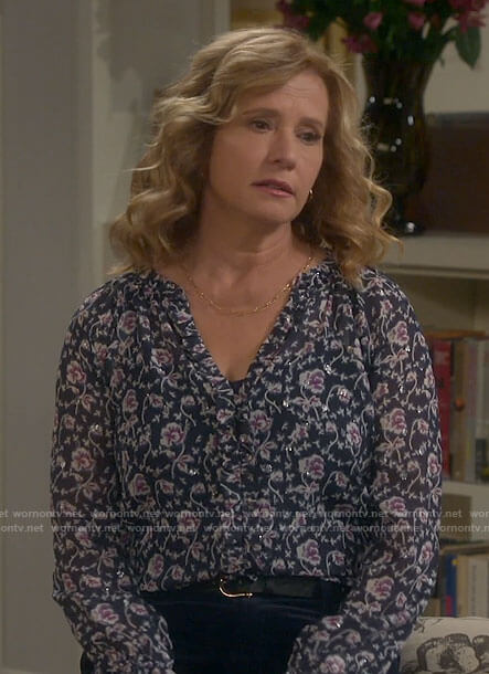 Vanessa’s navy floral metallic blouse on Last Man Standing