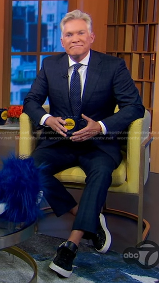 Sam Champion's black sneakers with white sole on Good Morning America