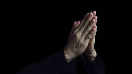 Man Praying Hands In Black Background Stock Photo, Picture And Royalty Free  Image. Image 138447545.