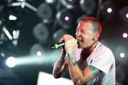 TOKYO - JULY 07:  Chester Bennington of Linkin Park performs on stage at the Tokyo leg of the Live Earth series of concerts, at Makuhari Messe, Chiba on July 7, 2007 in Tokyo, Japan. Launched by former US Vice President Al Gore to combat Global Warming, the concert is one of a series taking place over a 24-hour period on July 7 across seven continents.  (Photo by Junko Kimura/Getty Images)