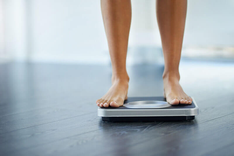 Woman Checking Her Weight