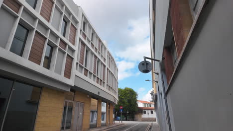 Urban-scene-in-Nicosia,-Cyprus,-featuring-modern-buildings-with-large-windows-and-balconies