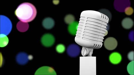 Retro-white-microphone-against-colorful-spots-of-light-against-black-background