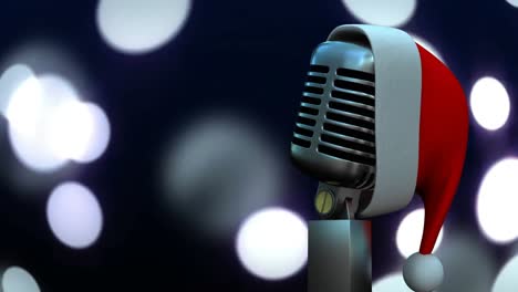 Santa-hat-over-microphone-against-spots-of-light-against-black-background