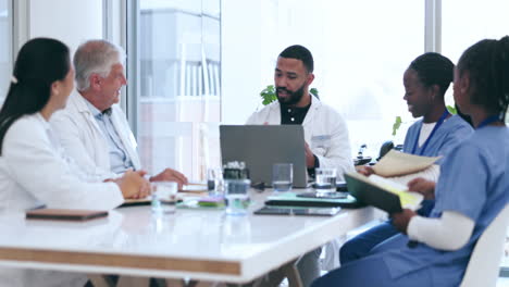 Group,-meeting-and-doctors-with-a-laptop