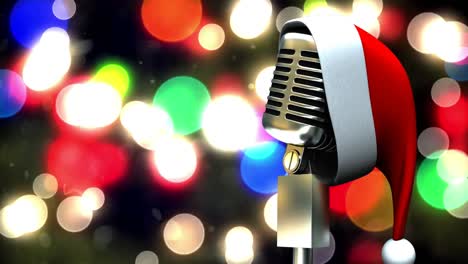 Santa-hat-over-microphone-against-colorful-spots-of-light-against-black-background