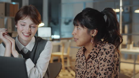 Two-Young-Multiethnic-Businesswomen-Working-Late-in-Office