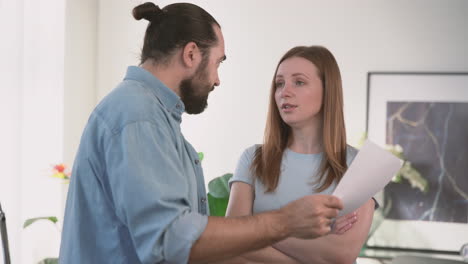 Very-Angry-Woman-Asks-A-Bearded-Man-To-Explain-Himself-To-Her-Over-Some-Papers