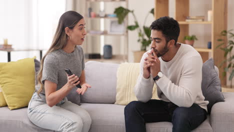 Angry,-fight-and-phone-with-couple-on-sofa