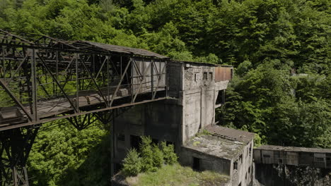 Desolate-rusty-platform-and-building-of-abandoned-factory-in-Chiatura