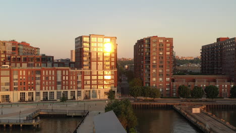 An-aerial-view-of-apartment-buildings-in-New-Jersey-with-the-sun-shining-on-the-windows-at-sunrise