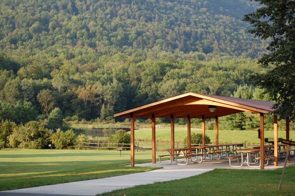 pavilion at a park with a forested mountain in the background