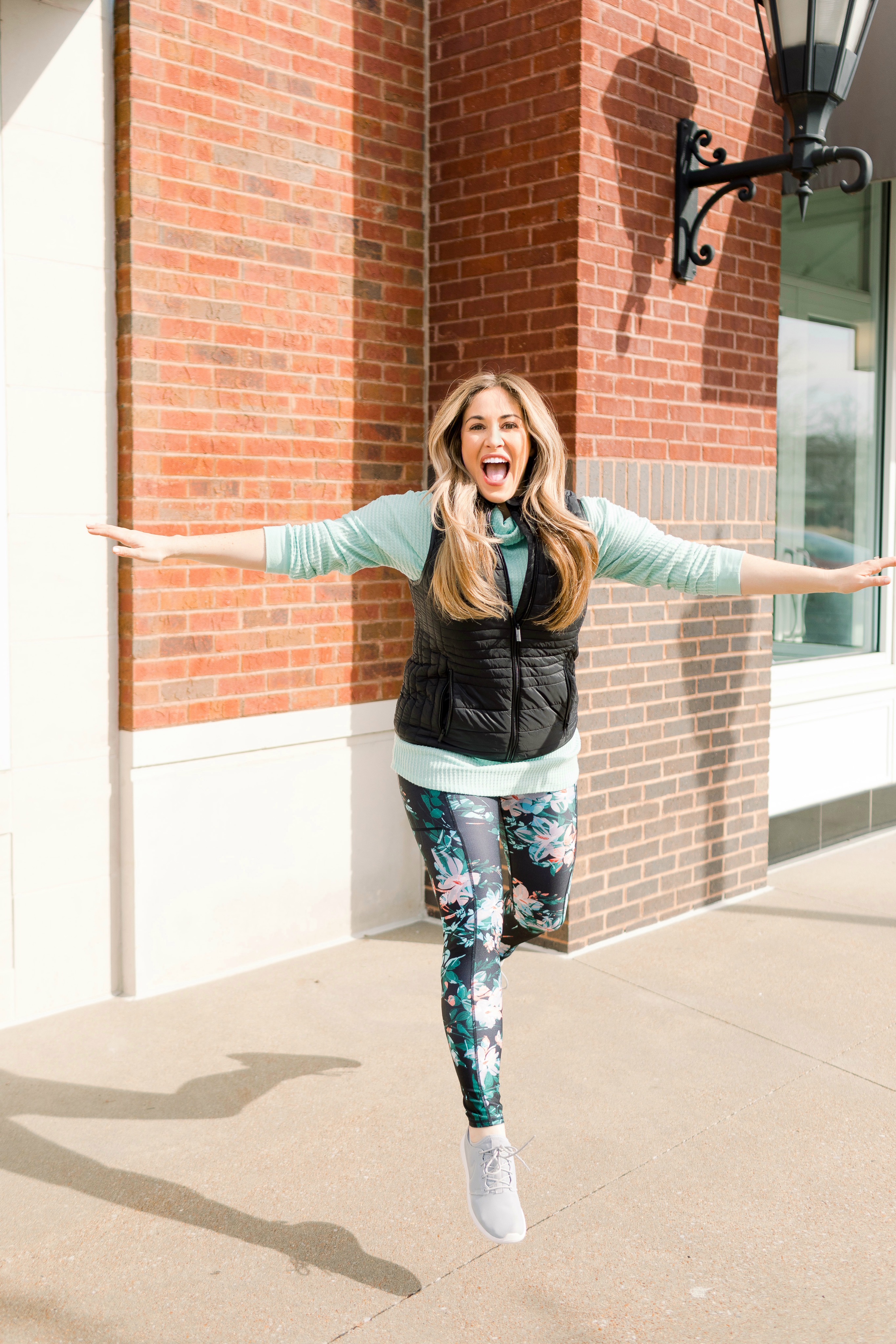 Top 10 Best Shoes for Working Out featured by top Memphis fitness blog, Walking in Memphis in High Heels: image of a woman wearing Nike Odyssey React Flyknit 2.