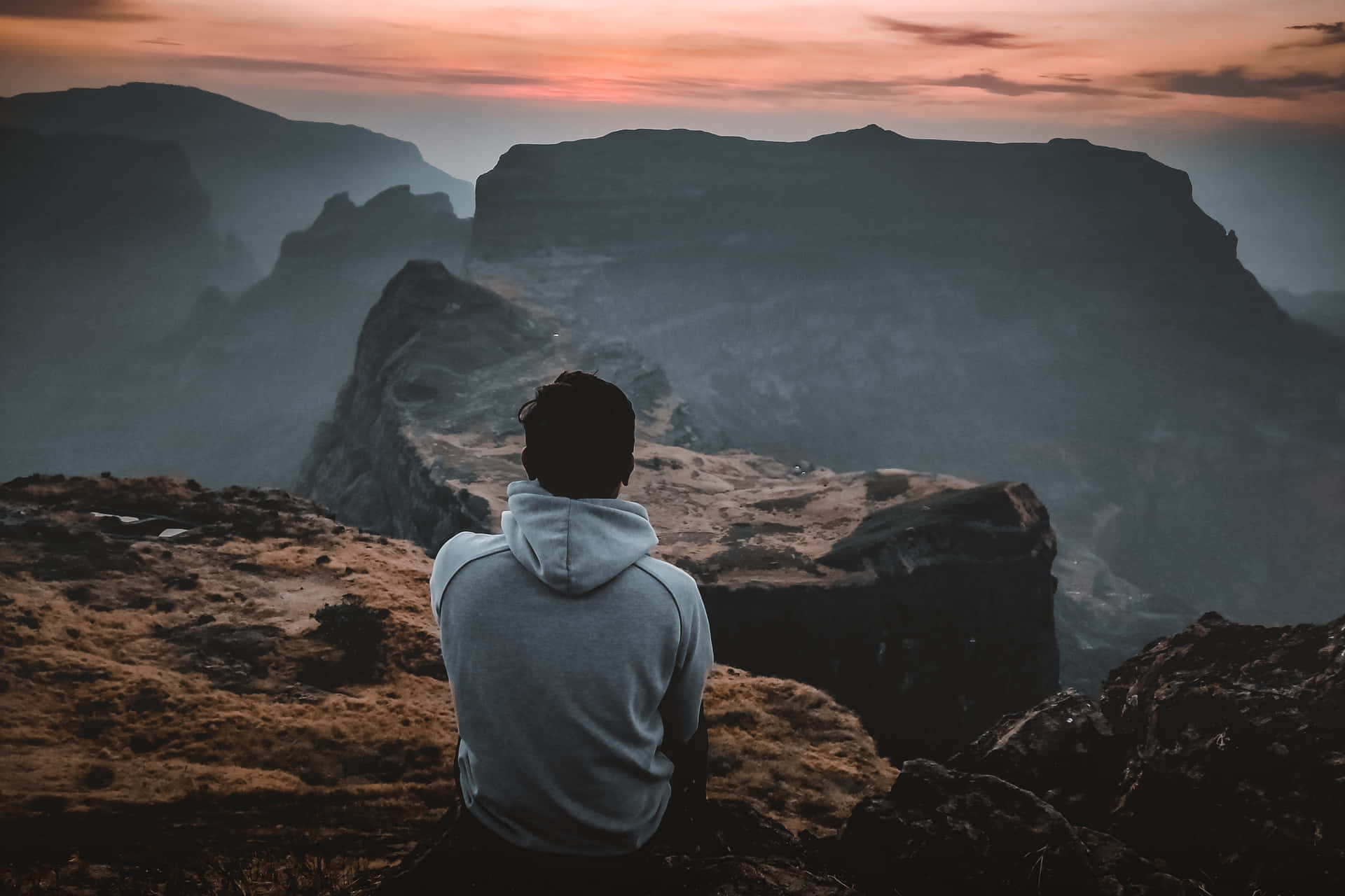 Man Resting After Arduous Trek Wallpaper