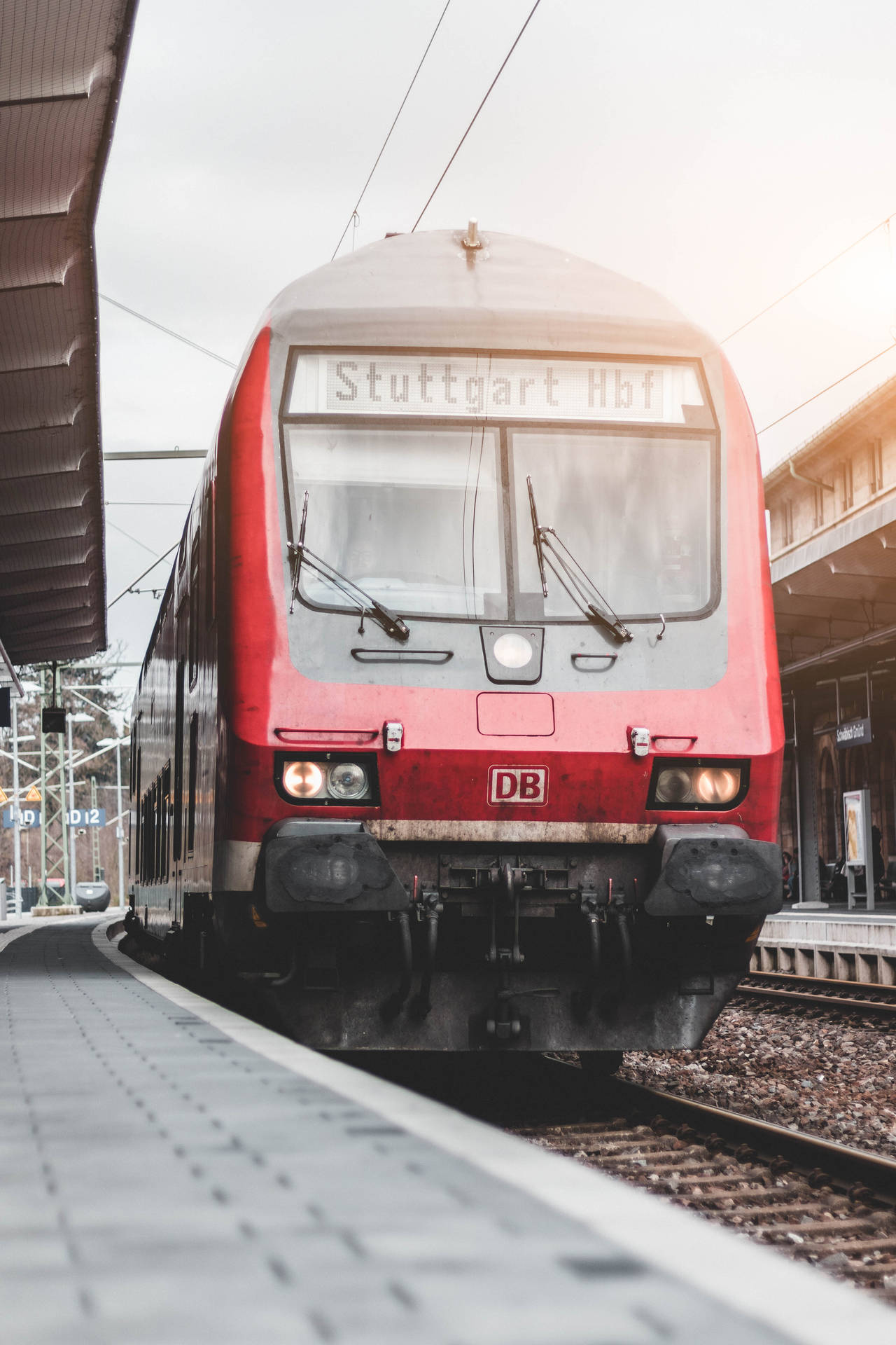 Red train arriving at the Stuttgart Hbf station Wallpaper