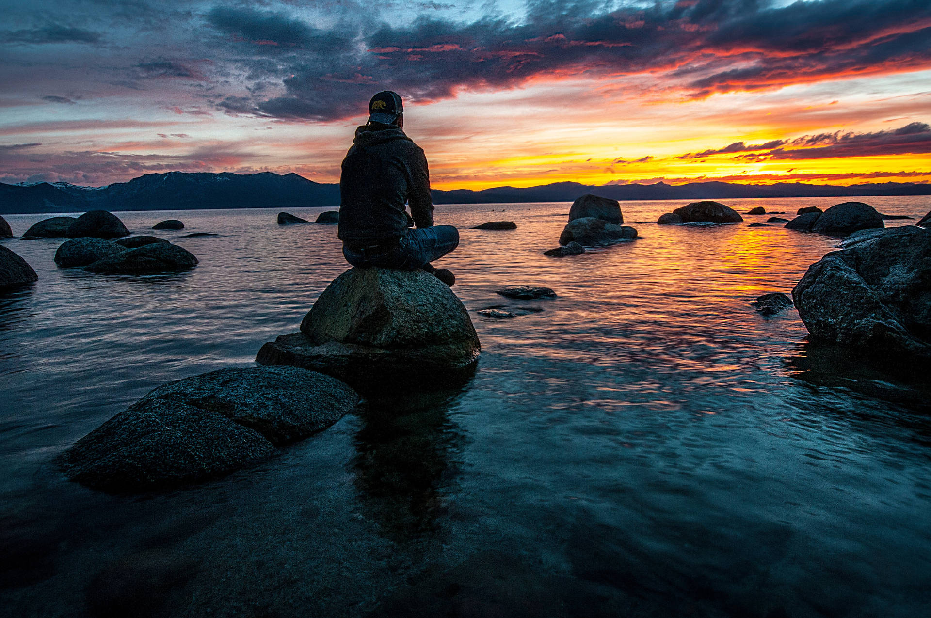 Sad Boy At Rocky Shore Wallpaper