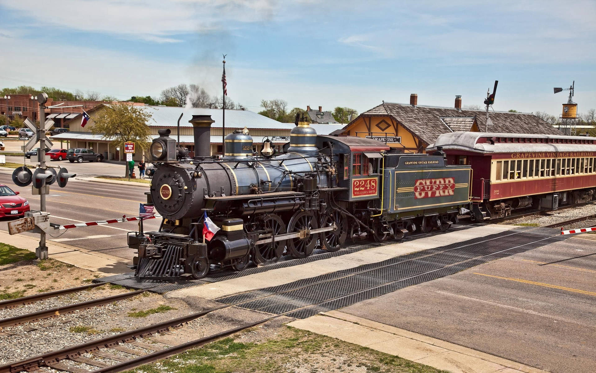 Passengers taking a vintage Steam Locomotive Train ride Wallpaper