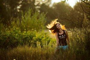 windy brunette women outdoors sunlight bokeh nature