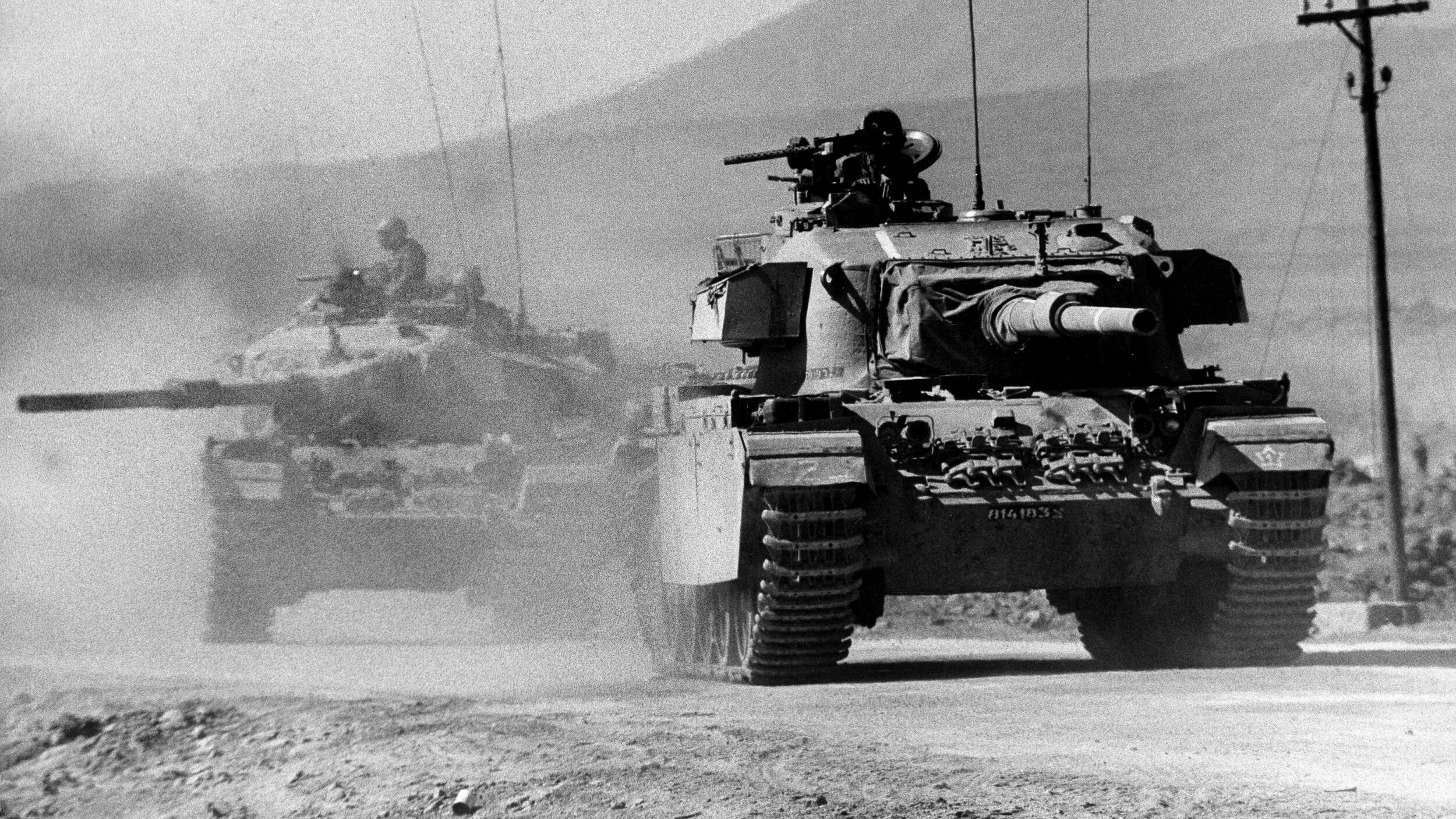 Israeli-upgraded Centurion main battle tanks (Sho’t Kal) advancing into Syria on October 11, 1973. Having withstood the initial four-day assault of the Yom Kippur War and retaken the Golan Heights, Israeli leaders immediately decided to invade Syria and knock them out of the war.