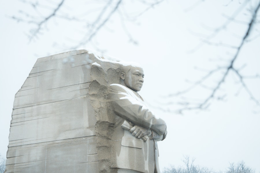 The Martin Luther King Jr. Memorial stands majestic with a light covering of snow in Washington, DC.