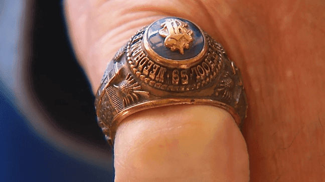 Michael Pedneau tries on his high school class ring from nearly 50 years ago. (WCHS)