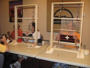 Students using small workshop looms by Henry Lee Dedman