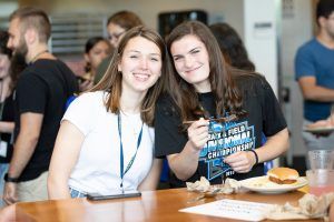 Two Worcester State students smiling for a photo on campus