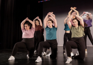 The Worcester State dance team performing on stage