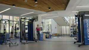 Two students working out at the Worcester state fitness center