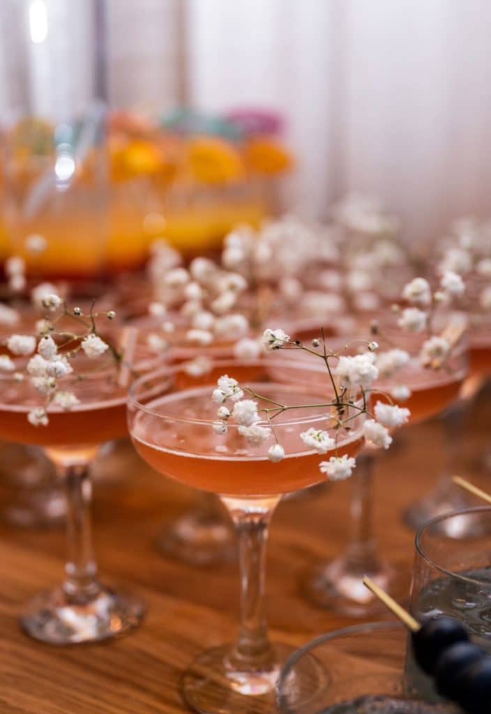 drinks in beautiful glasses, tint of red with white flowers on top, Orlando, FL