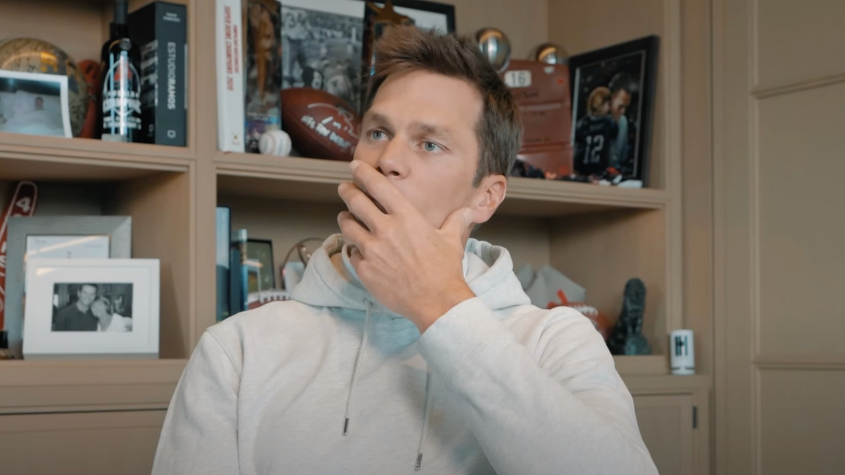 Tom Brady in a YouTube vlog reacting to his old videos.