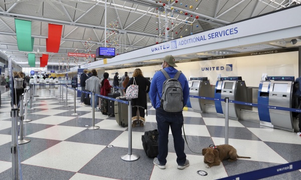 A photo of people inside an airport.