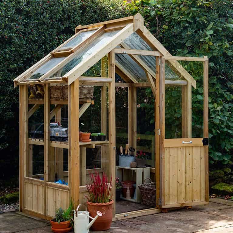 6'x4' Forest Vale Victorian Wooden Greenhouse with elegant design for optimal plant growth and outdoor gardening.