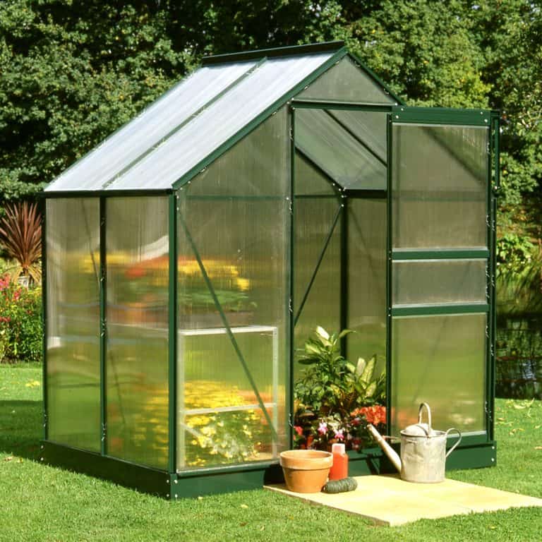 6'x4' Halls Green Frame Polycarbonate Greenhouse for optimal plant growth and durability in any garden setting.