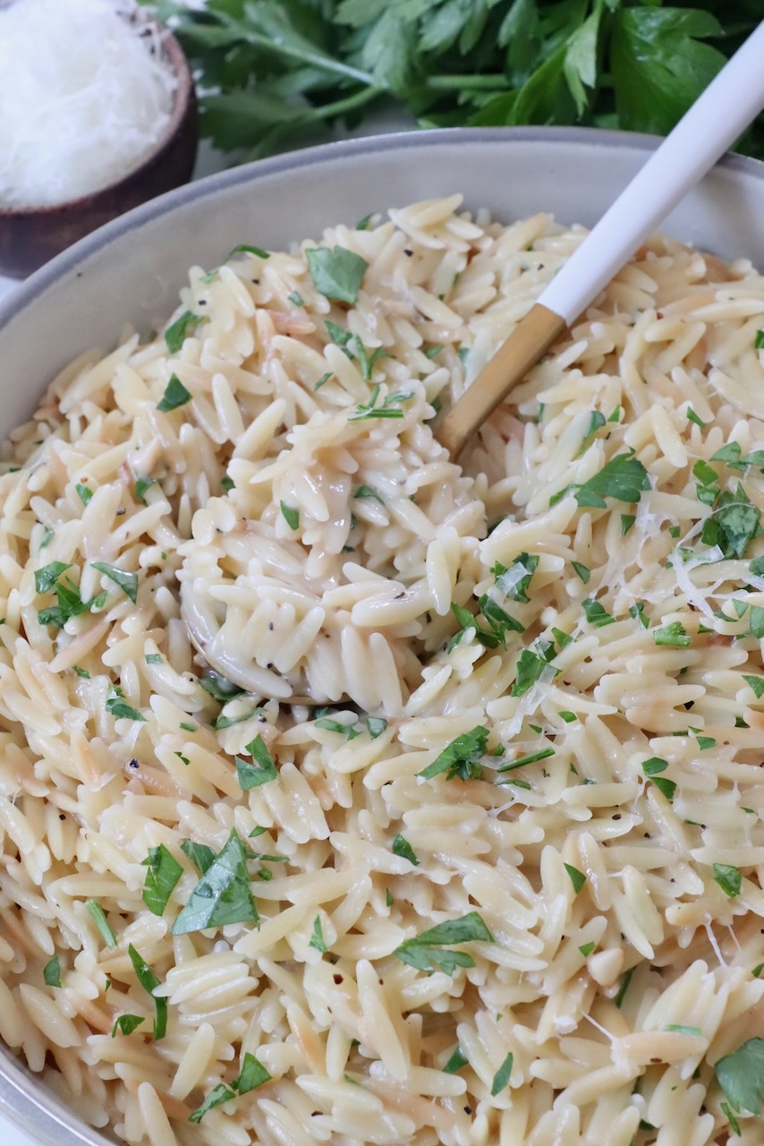 prepared orzo in a bowl with a spoon