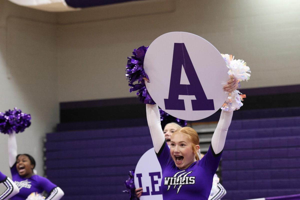 K-A-T-S. At the competition showcase on Thursday, sophomore Emma Stalder dazzles the crowd. The cheer team is headed to UIL competition in Ft. Worth today.