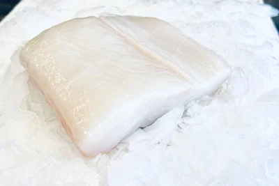 Fresh white fish fillet on ice.