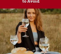 Woman on an open field with wine glass in hand - Riesling Snack & Appetizer Pairing