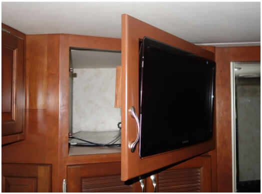 Bedroom TV mounted with swinging door