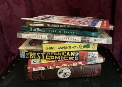 A collection of graphic novels, comics and comics journalism works. (Lisa Creamer/WBUR)